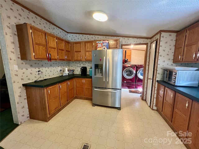 343 Daytona Ln, Saluda, NC 28773 - kitchen with stainless steel fridge, crown molding, independent washer and dryer, and wallpapered walls