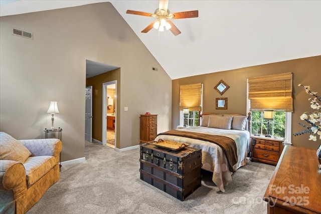 carpeted bedroom with multiple windows, visible vents, baseboards, and high vaulted ceiling
