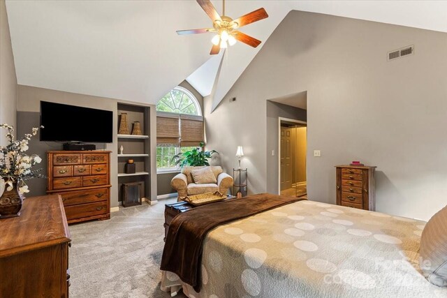 bedroom with ceiling fan, visible vents, carpet floors, and high vaulted ceiling