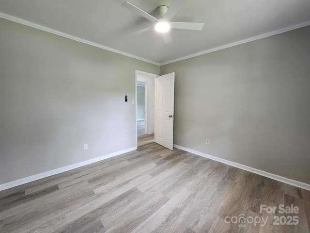 409 S Martin Luther King Jr Ave, Salisbury, NC 28144 - spare room featuring ceiling fan, wood finished floors, baseboards, and crown molding