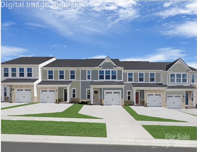 view of property with brick siding, a garage, driveway, and a front yard