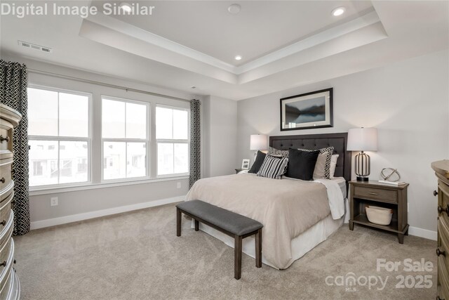 bedroom with recessed lighting, baseboards, light carpet, and a raised ceiling
