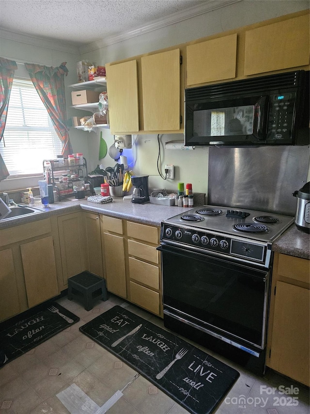 515 Benton St, Monroe, NC 28110 - kitchen with light brown cabinetry, a sink, light countertops, a textured ceiling, and black appliances