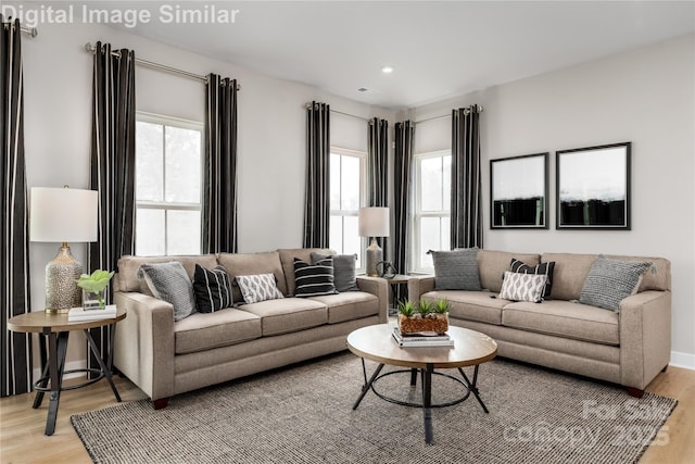 living area featuring recessed lighting and light wood-style floors