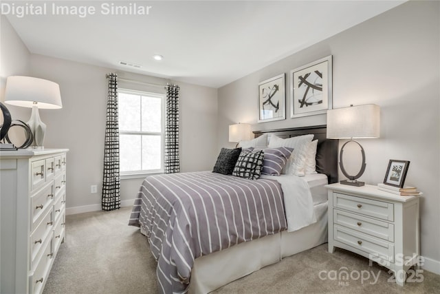 bedroom with carpet flooring, baseboards, and visible vents