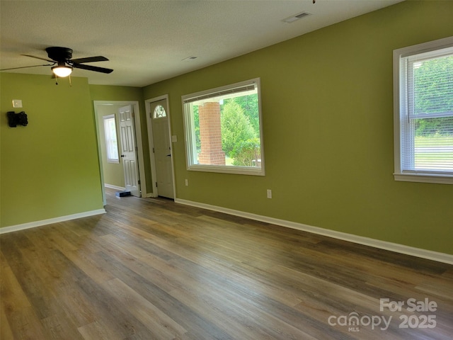 3634 Cartledge Creek Rd, Mount Gilead, NC 27306 - spare room featuring wood finished floors, ceiling fan, and baseboards