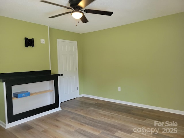 3634 Cartledge Creek Rd, Mount Gilead, NC 27306 - empty room with wood finished floors, ceiling fan, and baseboards