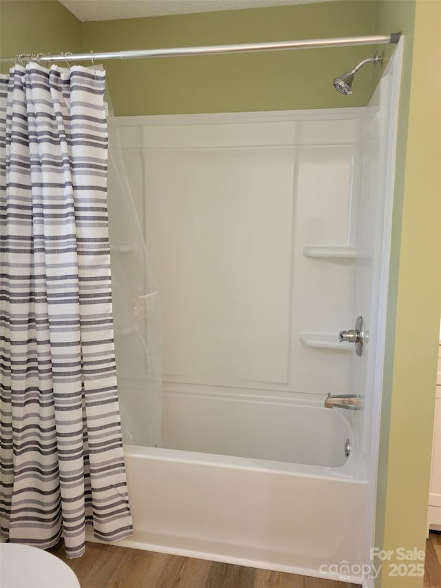 3634 Cartledge Creek Rd, Mount Gilead, NC 27306 - bathroom featuring shower / tub combo with curtain, wood finished floors, and toilet