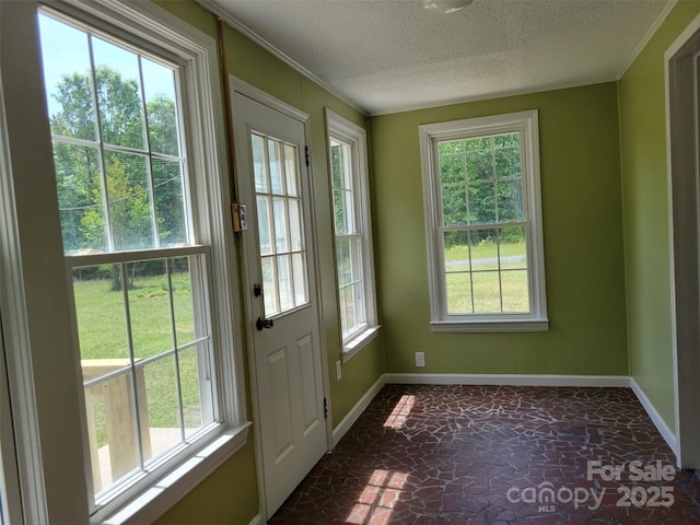 3634 Cartledge Creek Rd, Mount Gilead, NC 27306 - doorway to outside with baseboards, crown molding, and a textured ceiling