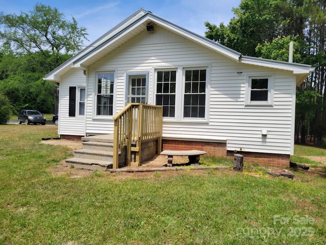 3634 Cartledge Creek Rd, Mount Gilead, NC 27306 - back of property with a lawn and crawl space