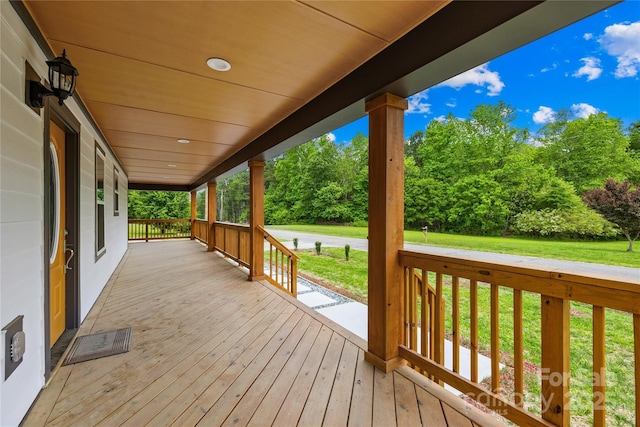 662 Camp Ferry Rd, Mooresboro, NC 28114 - deck featuring a porch, a lawn, and view of scattered trees