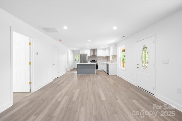 662 Camp Ferry Rd, Mooresboro, NC 28114 - unfurnished living room with light wood-style flooring, recessed lighting, and baseboards
