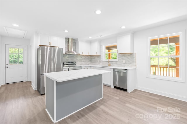 662 Camp Ferry Rd, Mooresboro, NC 28114 - kitchen featuring appliances with stainless steel finishes, wall chimney range hood, a sink, a center island, and tasteful backsplash