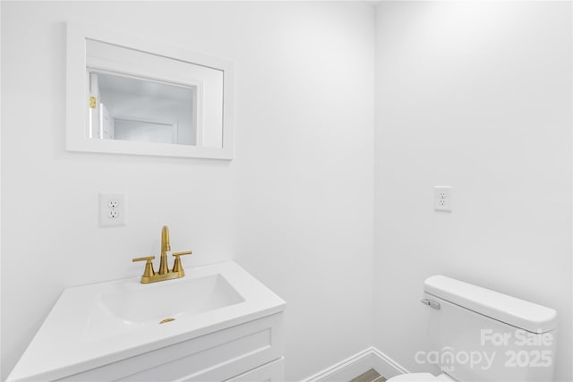 662 Camp Ferry Rd, Mooresboro, NC 28114 - bathroom featuring toilet, baseboards, and vanity