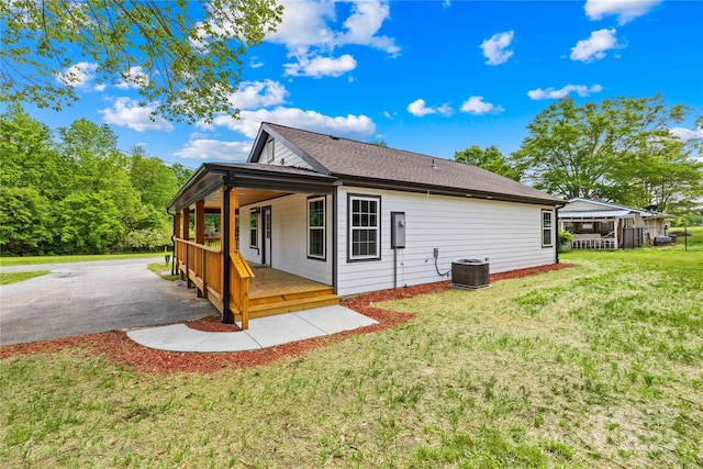 662 Camp Ferry Rd, Mooresboro, NC 28114 - back of house featuring a lawn and central AC