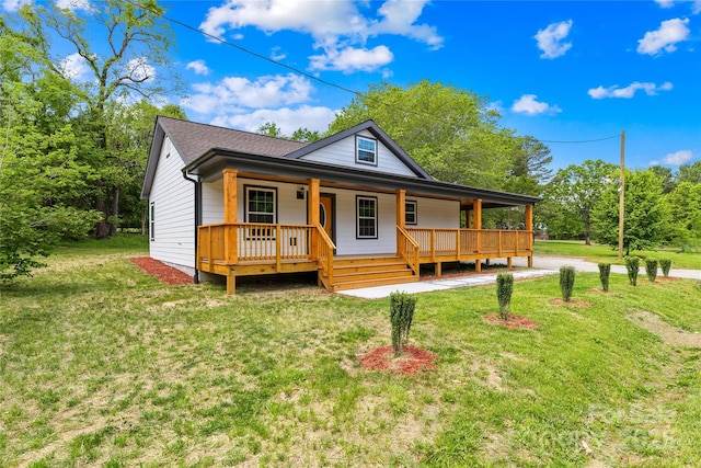 662 Camp Ferry Rd, Mooresboro, NC 28114 - view of front of house featuring covered porch, a front lawn, and a shingled roof