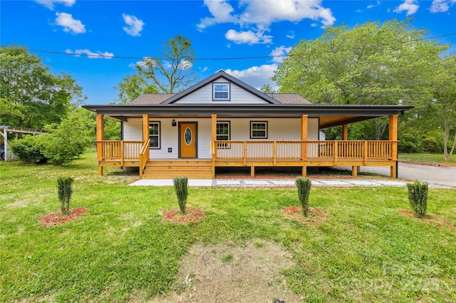 662 Camp Ferry Rd, Mooresboro, NC 28114 - farmhouse-style home featuring covered porch, a front lawn, and roof with shingles