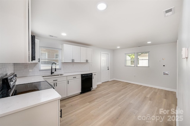 kitchen with visible vents, tasteful backsplash, a sink, dishwasher, and stainless steel electric range oven