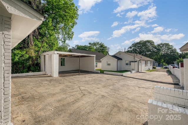 exterior space featuring a carport