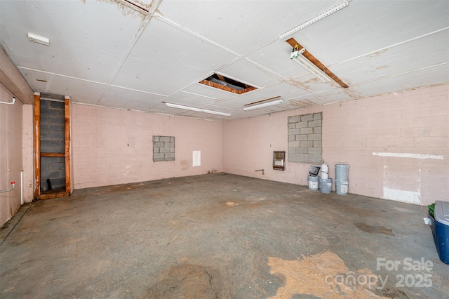 interior space featuring concrete block wall