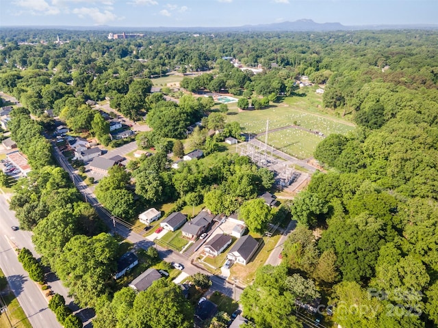 aerial view featuring a wooded view
