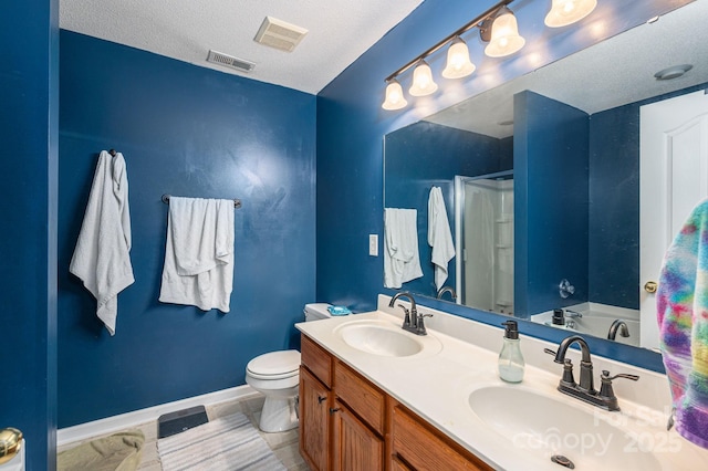 bathroom featuring a sink, a shower stall, and visible vents