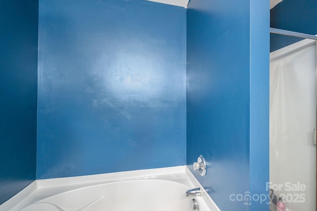 bathroom with a garden tub