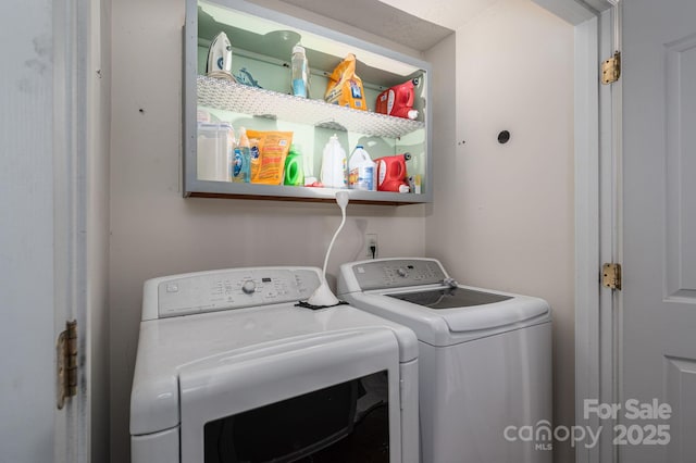 washroom featuring laundry area and washer and clothes dryer