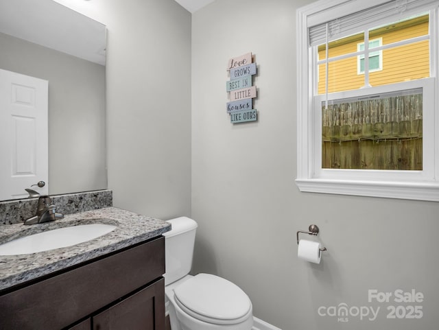 bathroom featuring vanity and toilet
