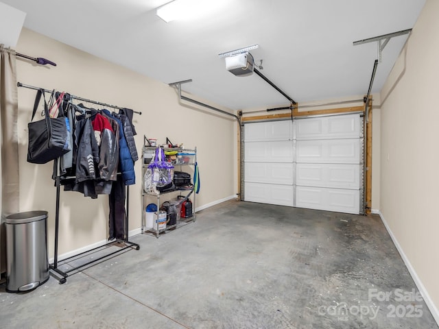 garage featuring baseboards and a garage door opener