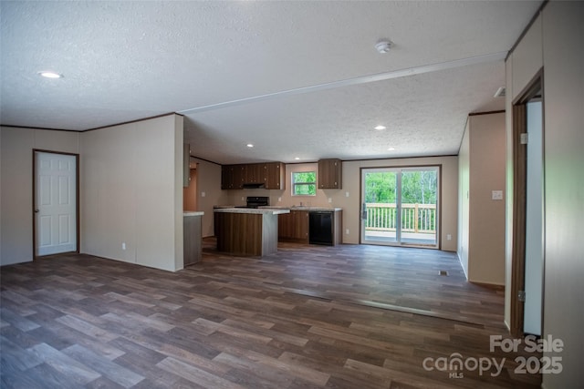unfurnished living room with recessed lighting, dark wood finished floors, and a textured ceiling
