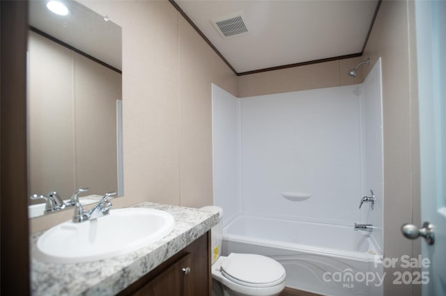 full bathroom featuring visible vents, ornamental molding, vanity, toilet, and bathtub / shower combination