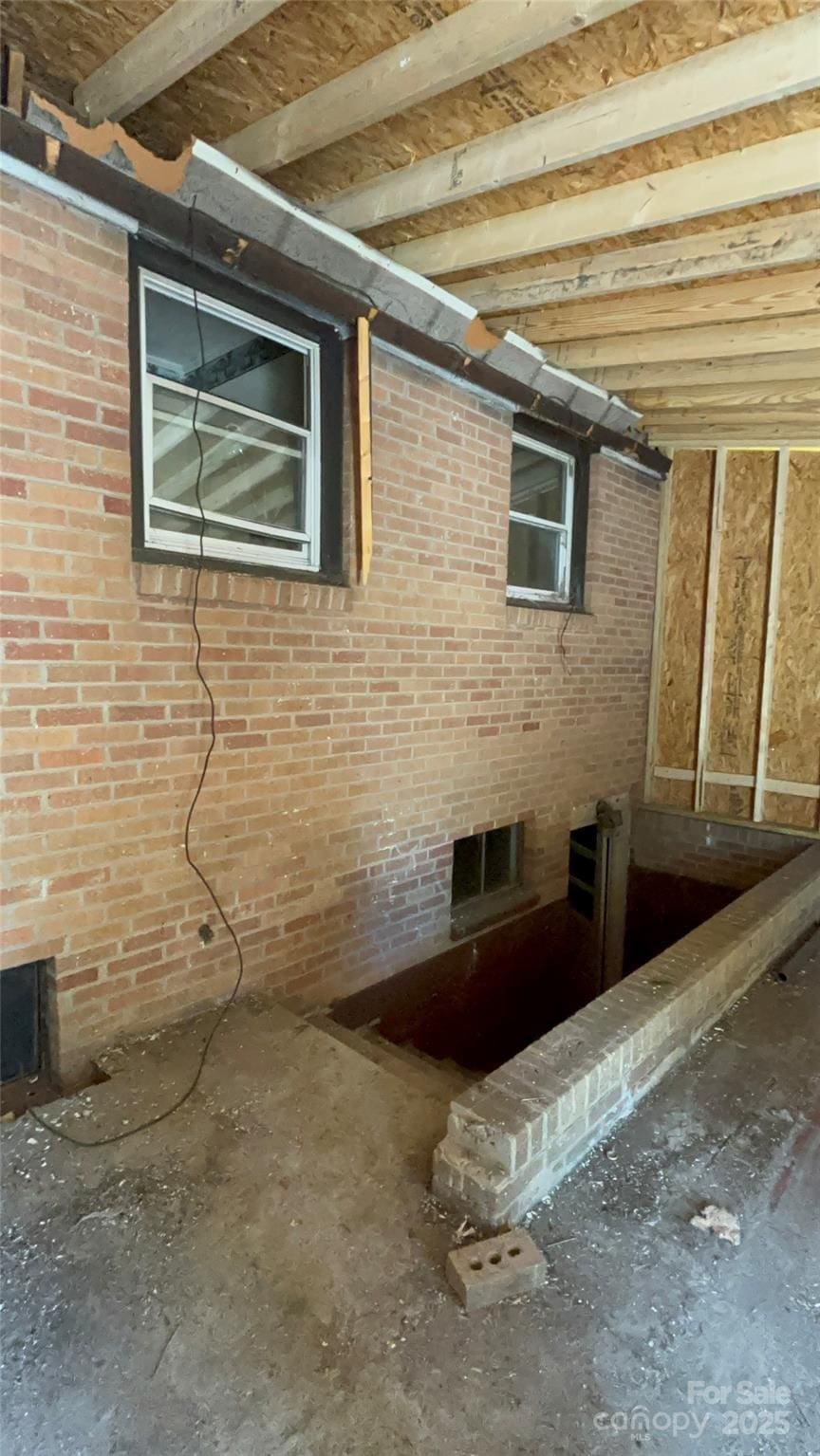view of property exterior featuring brick siding