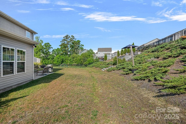 view of yard with a patio and fence