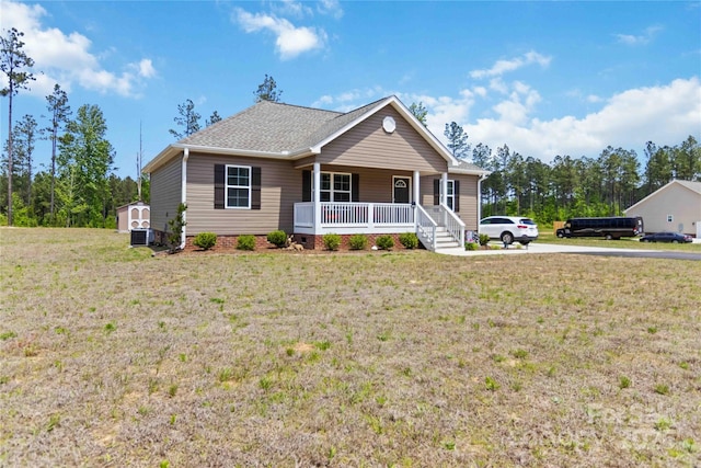 3015 Great Falls Highway, Chester, SC 29014 - view of front facade featuring roof with shingles, central air condition unit, covered porch, and a front yard