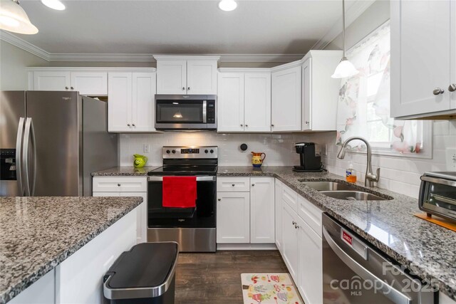 3015 Great Falls Highway, Chester, SC 29014 - kitchen featuring crown molding, white cabinets, appliances with stainless steel finishes, a sink, and decorative light fixtures