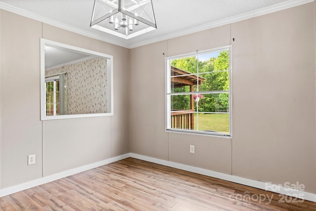 2521 Melvin Propst Dr, Morganton, NC 28655 - empty room with a chandelier, ornamental molding, wood finished floors, and baseboards