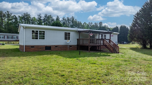 2521 Melvin Propst Dr, Morganton, NC 28655 - rear view of house with a wooden deck, crawl space, a yard, metal roof, and view of scattered trees