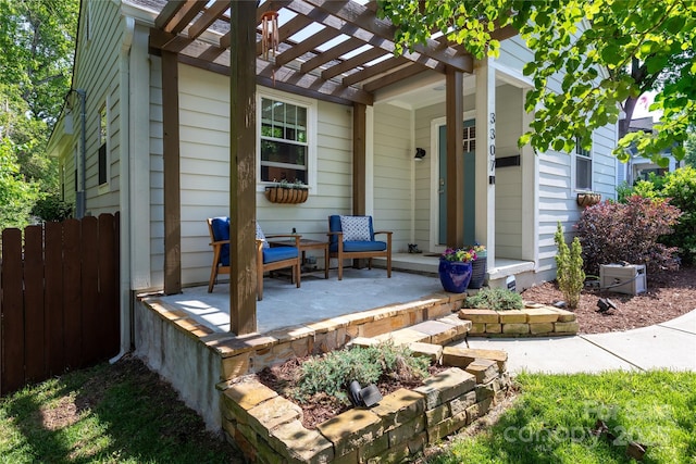 exterior space with fence, a pergola, and covered porch