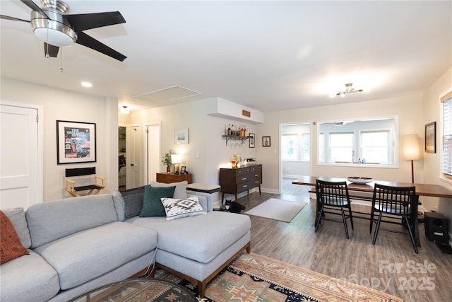 living room with wood finished floors, baseboards, attic access, recessed lighting, and a ceiling fan