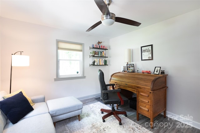 home office featuring baseboards, ceiling fan, and wood finished floors