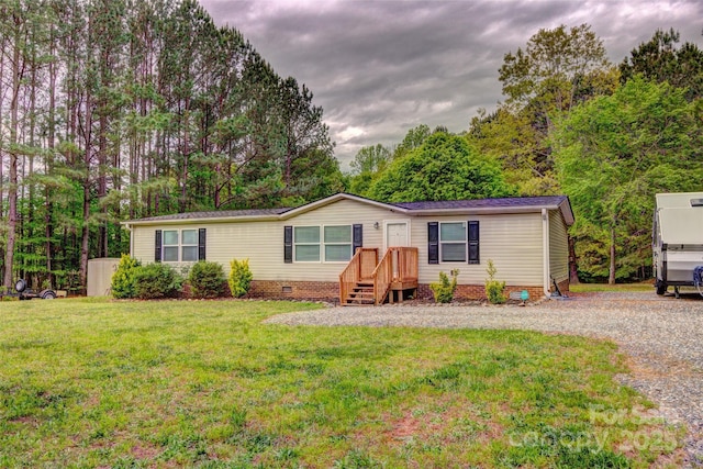 101 J M Ln, Lawndale, NC 28090 - manufactured / mobile home featuring crawl space, gravel driveway, and a front lawn