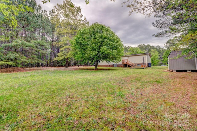 101 J M Ln, Lawndale, NC 28090 - view of yard with a shed, an outbuilding, and a wooden deck