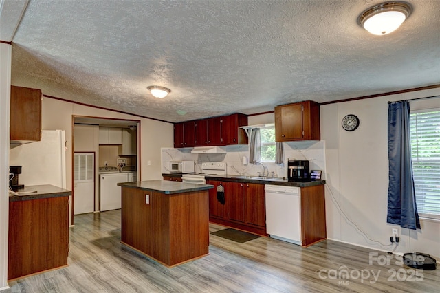 101 J M Ln, Lawndale, NC 28090 - kitchen featuring crown molding, dark countertops, light wood-type flooring, and white appliances