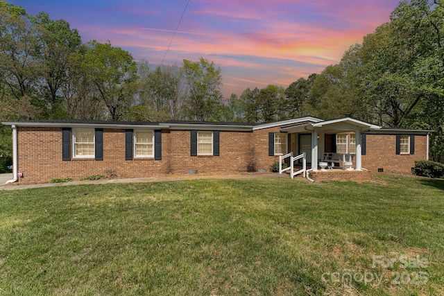 5013 Friendship Circle Rd, East Bend, NC 27018 - ranch-style house with brick siding, crawl space, a yard, and covered porch