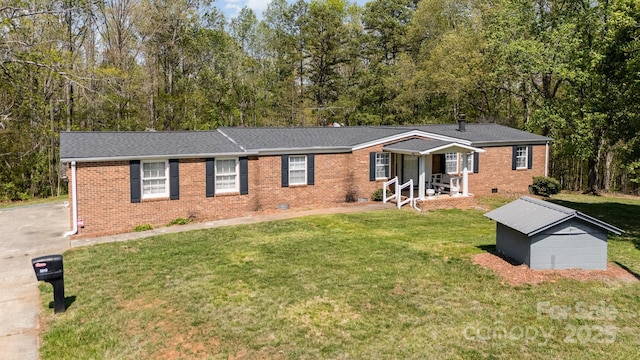 5013 Friendship Circle Rd, East Bend, NC 27018 - ranch-style house featuring brick siding, a front lawn, crawl space, and view of wooded area