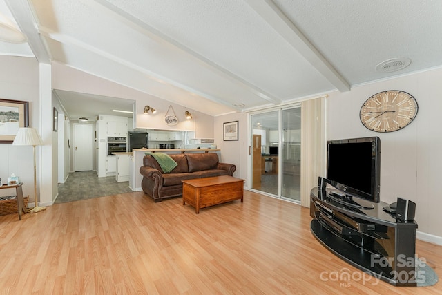 5013 Friendship Circle Rd, East Bend, NC 27018 - living room featuring light wood-type flooring and a textured ceiling