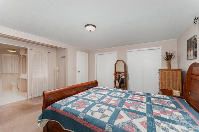 5013 Friendship Circle Rd, East Bend, NC 27018 - bedroom with carpet floors, two closets, crown molding, a textured ceiling, and ensuite bath