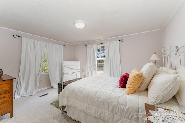 5013 Friendship Circle Rd, East Bend, NC 27018 - bedroom with multiple windows, light colored carpet, and crown molding