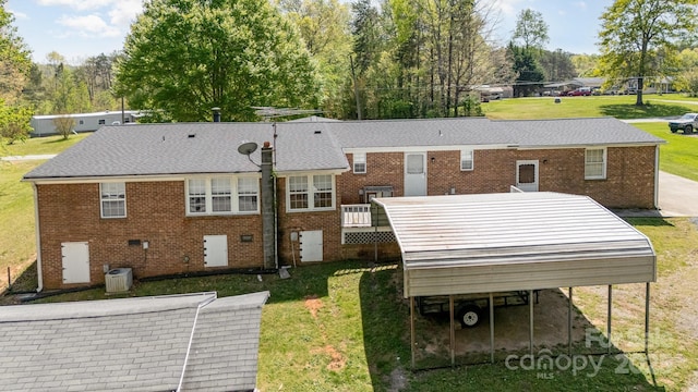 5013 Friendship Circle Rd, East Bend, NC 27018 - back of property with a lawn, brick siding, and a wooden deck